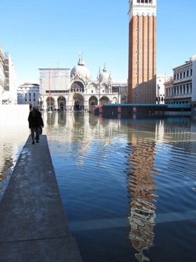 woman walking on a pontoon in the city