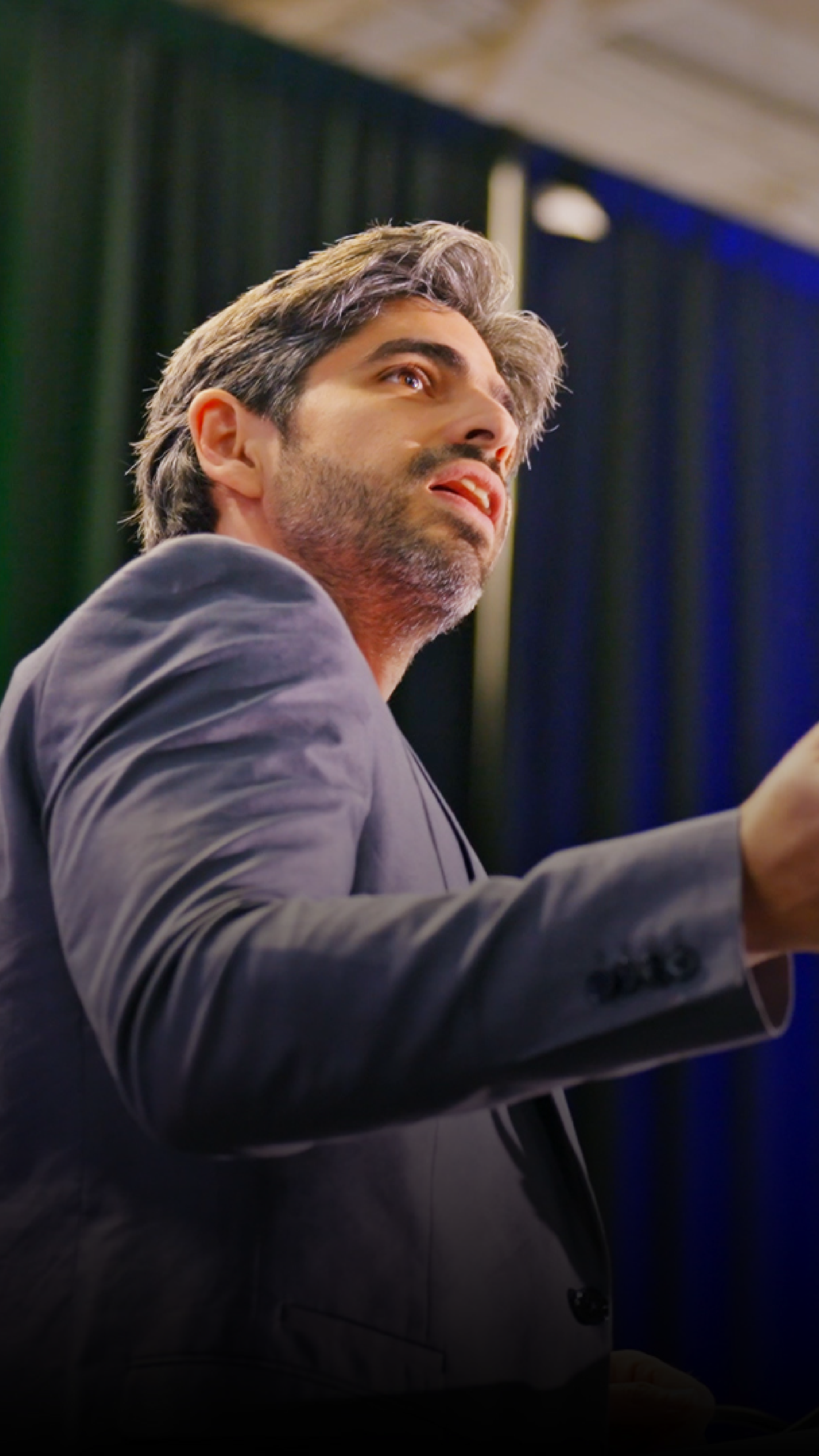 Artistic portrait with red and blue lighting creating a dramatic effect