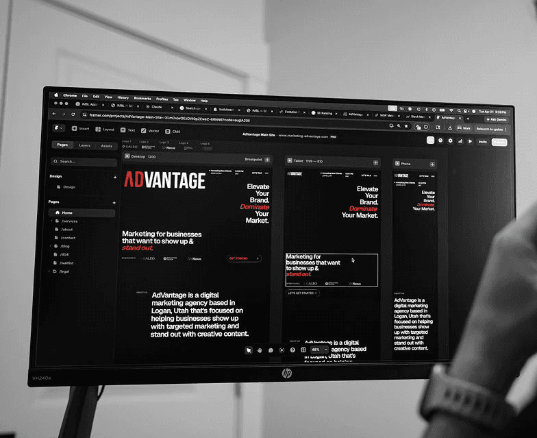 AdVantage marketing employee working on a website design, on screen showing different break points for desktop, tablet, and mobile optimized versions of the website. 