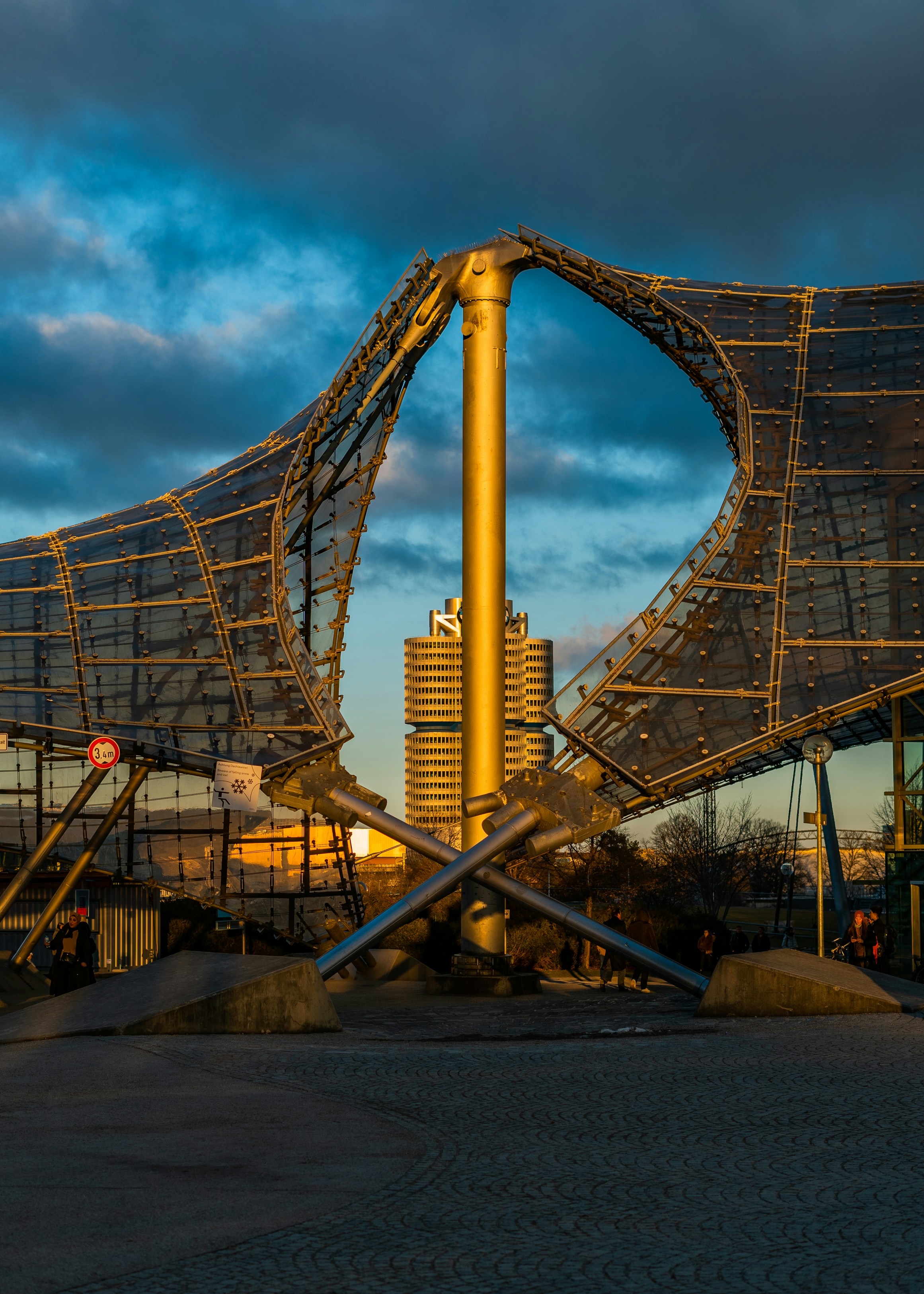 Modern stadium architecture against a sunset sky