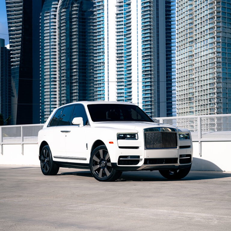 White Rolls-Royce Cullinan rental in Miami, front 3/4 view, ultimate luxury SUV hire.