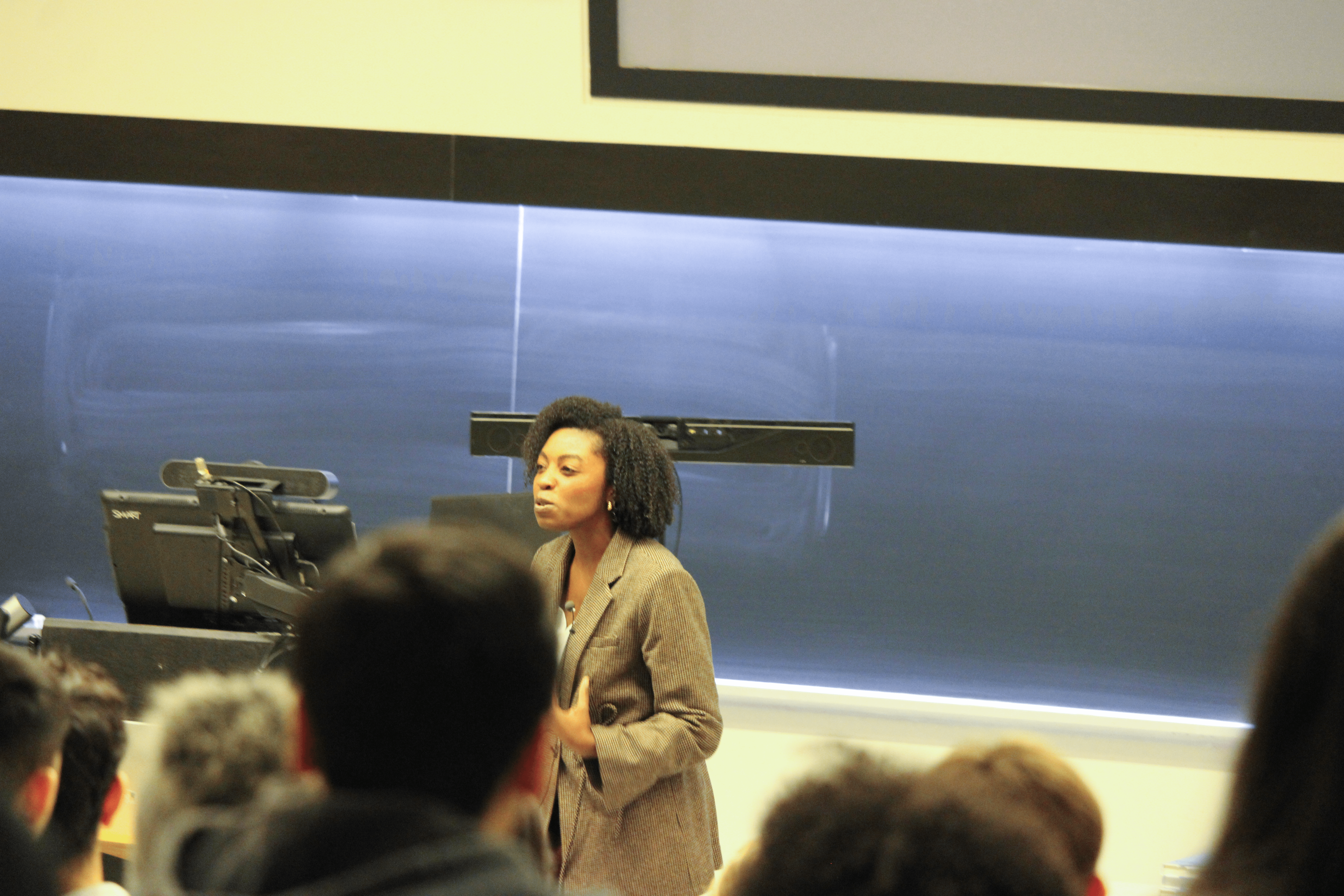 An orange cube-shaped side table is shown.