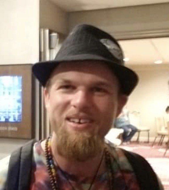 a black and white photo of a man in a coat