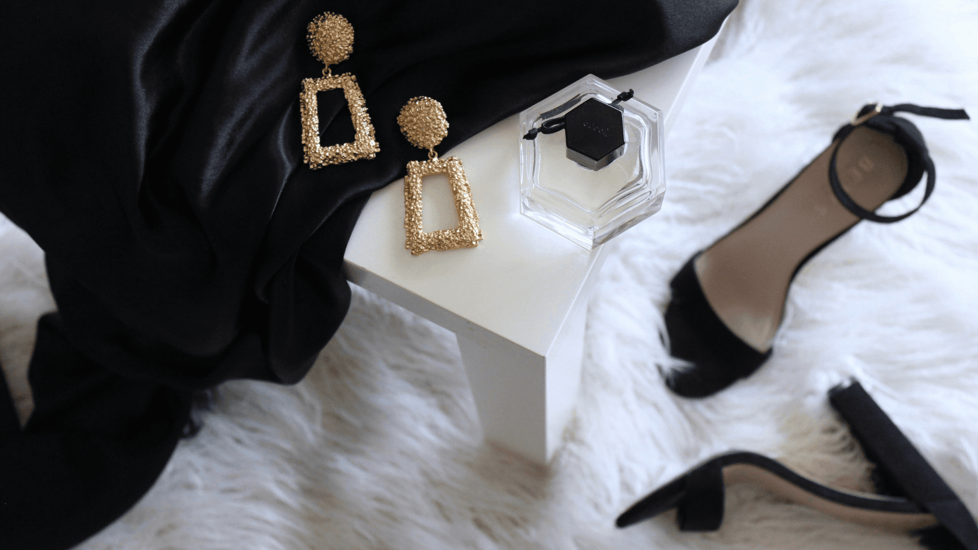 A selection of luxury clothing and jewellery items