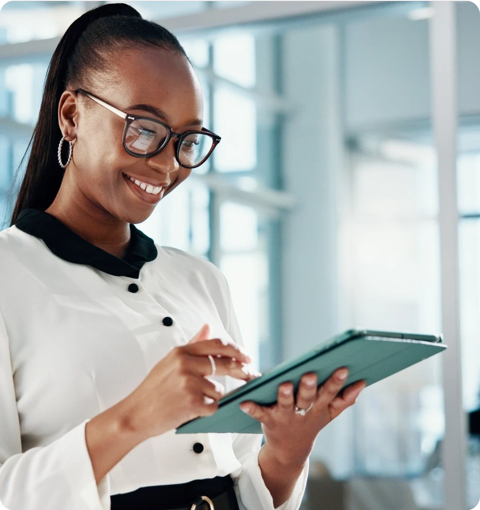 A dark cylindrical object on a wooden bar, with softly glowing lights in the blurred background.