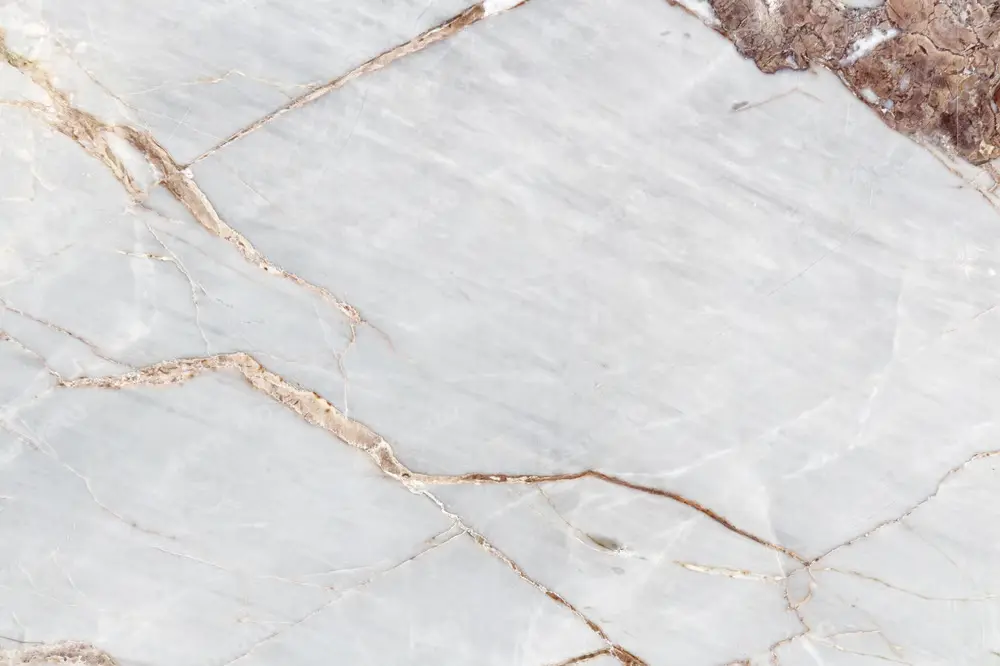 A slab of Light Emperador marble showing its soft beige and light brown tones with delicate veining.