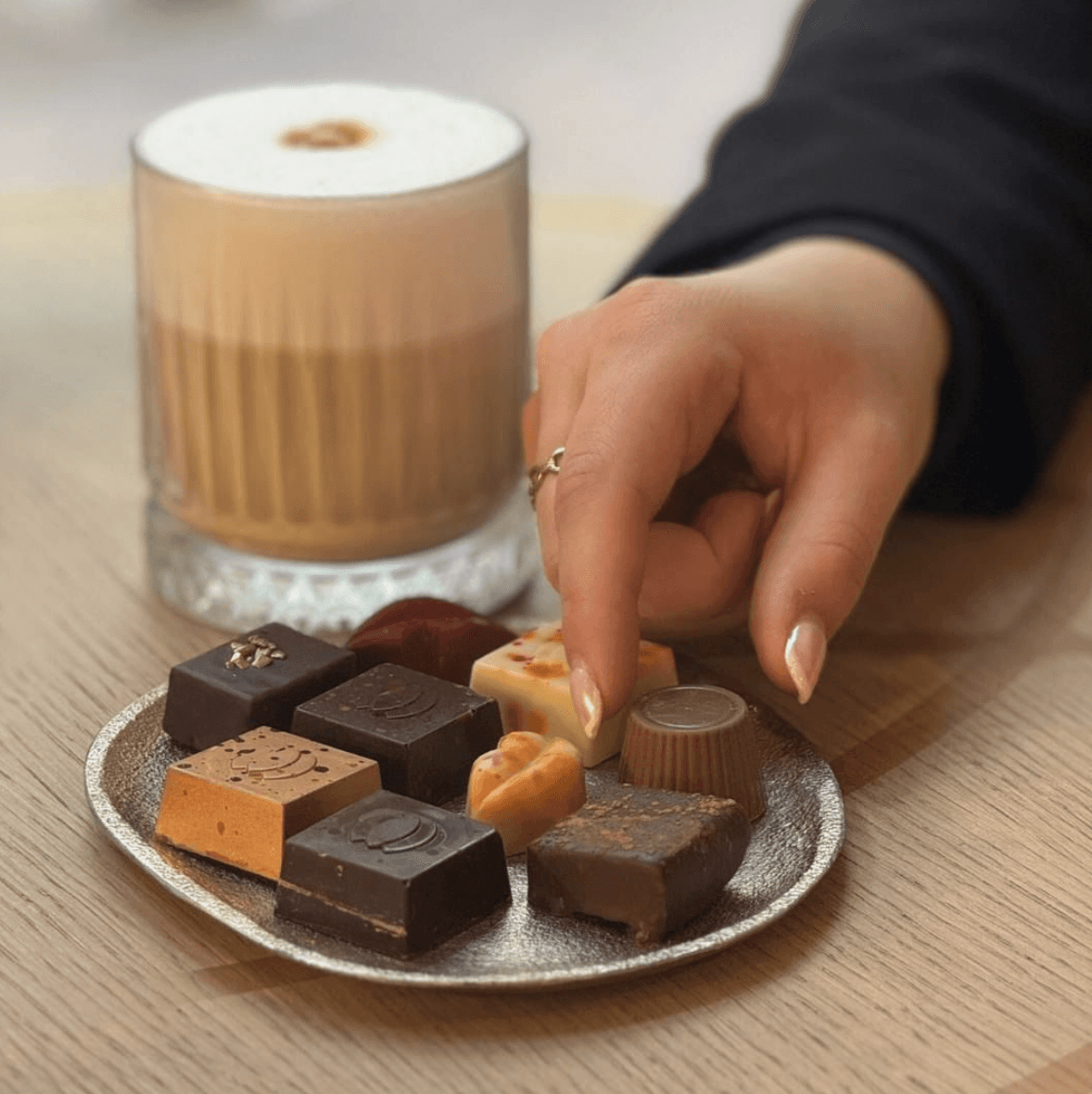 Picture of coco & sebas chocolate with a coffee