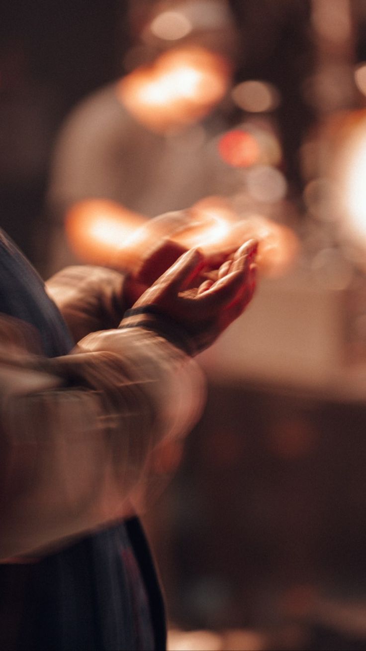 person holding string lights