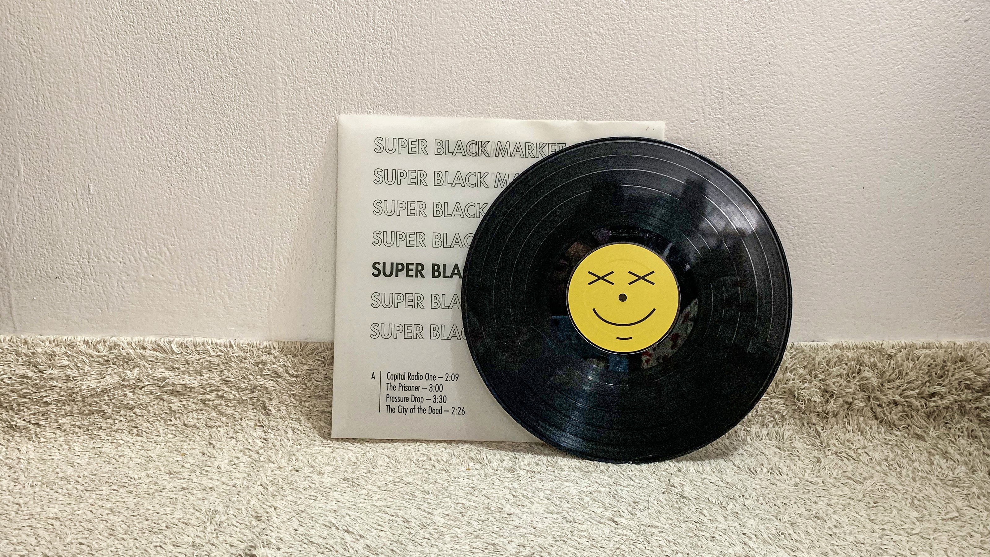 Qi Zheng vinyl disk in front of its case