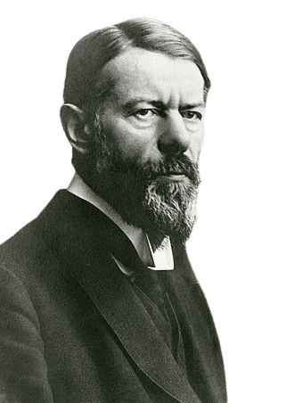 A black-and-white portrait of a man with a full beard, intense gaze, and neatly styled hair, dressed in formal early 20th-century attire with a high collar. His serious expression and thoughtful demeanor suggest he is a prominent intellectual or academic figure, conveying authority and depth of thought.