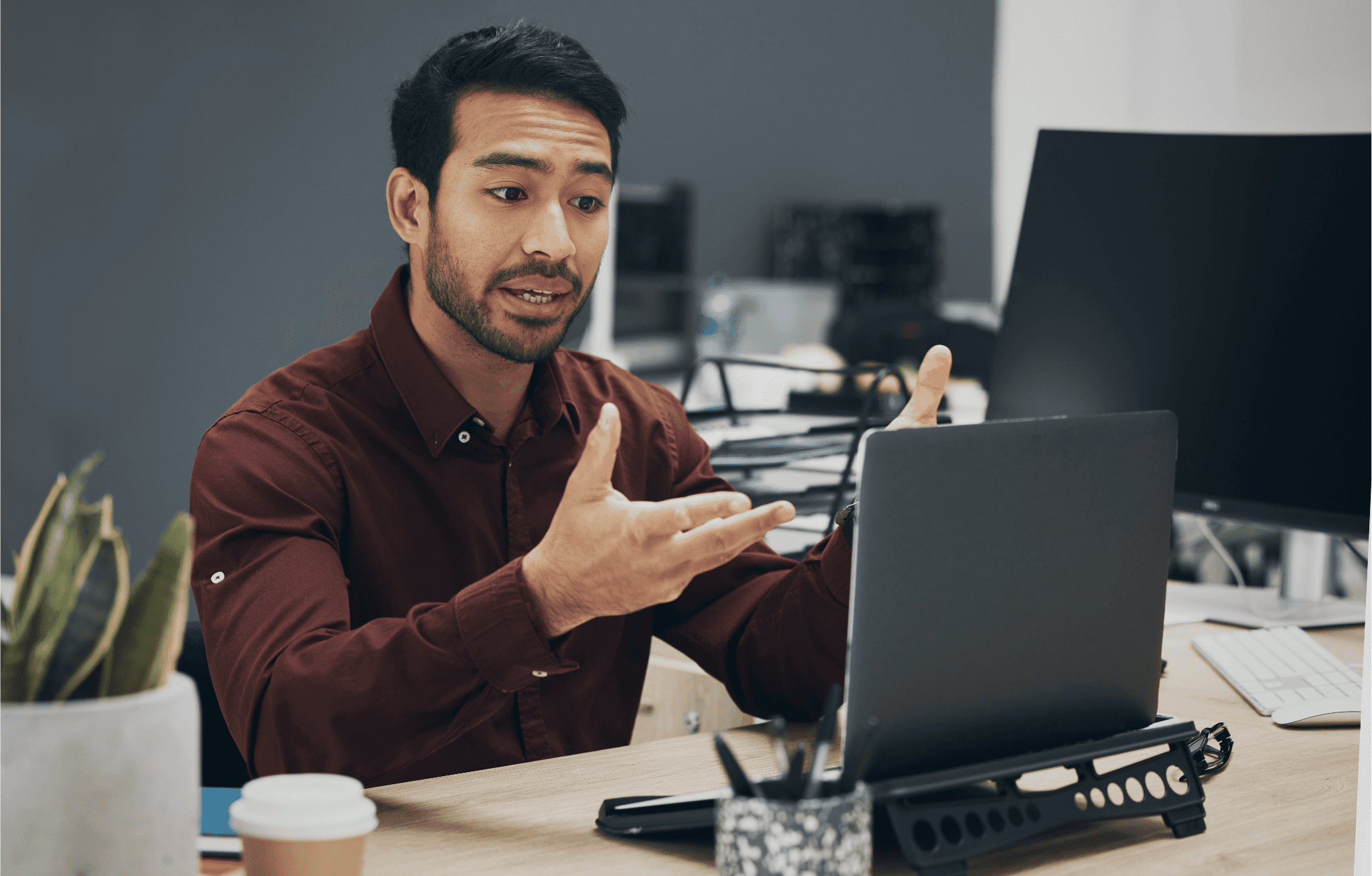 Conversation, video call and laptop with man in office for conference, online meeting and webinar. Planning, webcam and internet with employee for virtual communication, conversation and technology.
