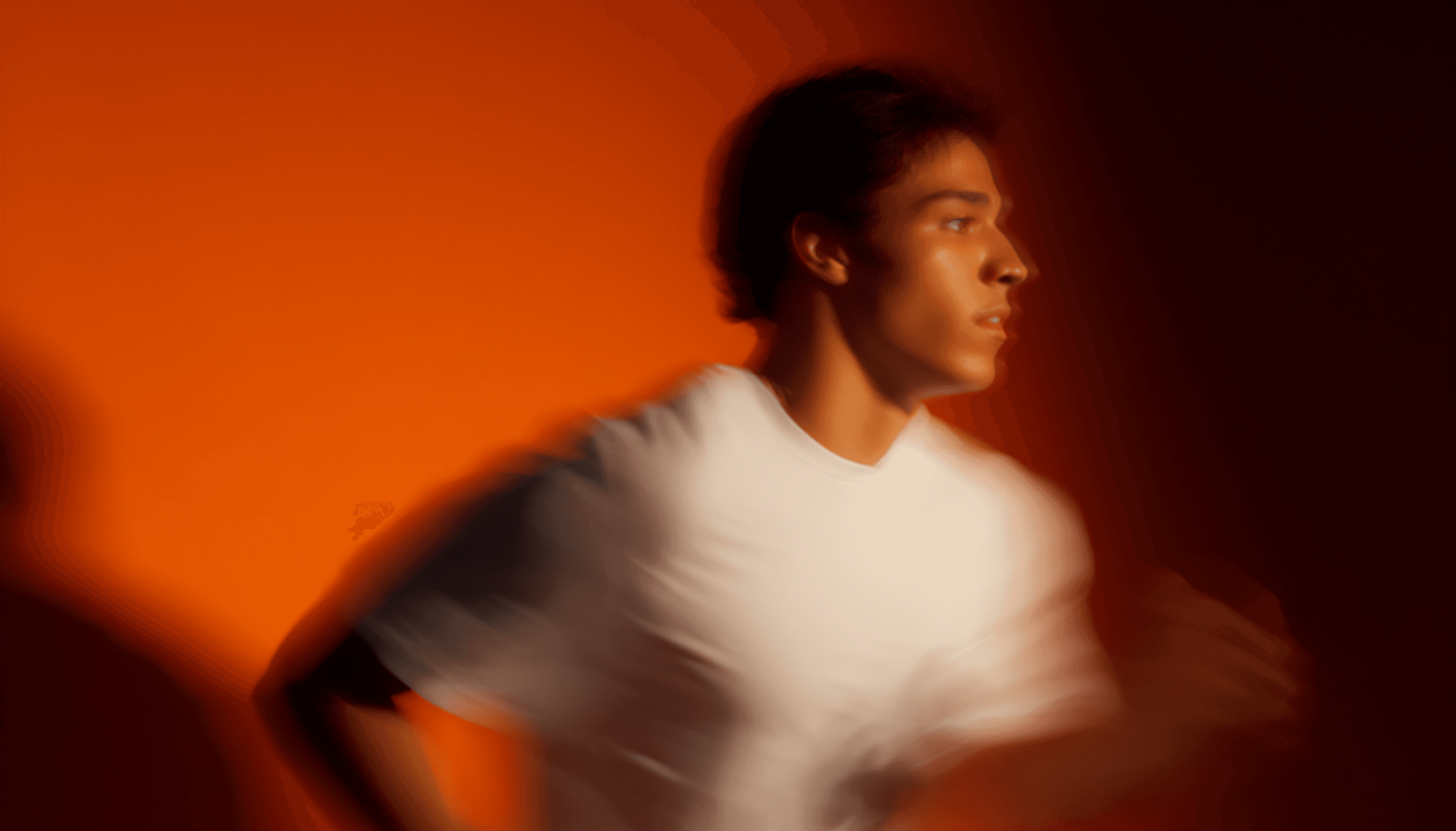 Conceptual image of a person in a white shirt, blurred motion.