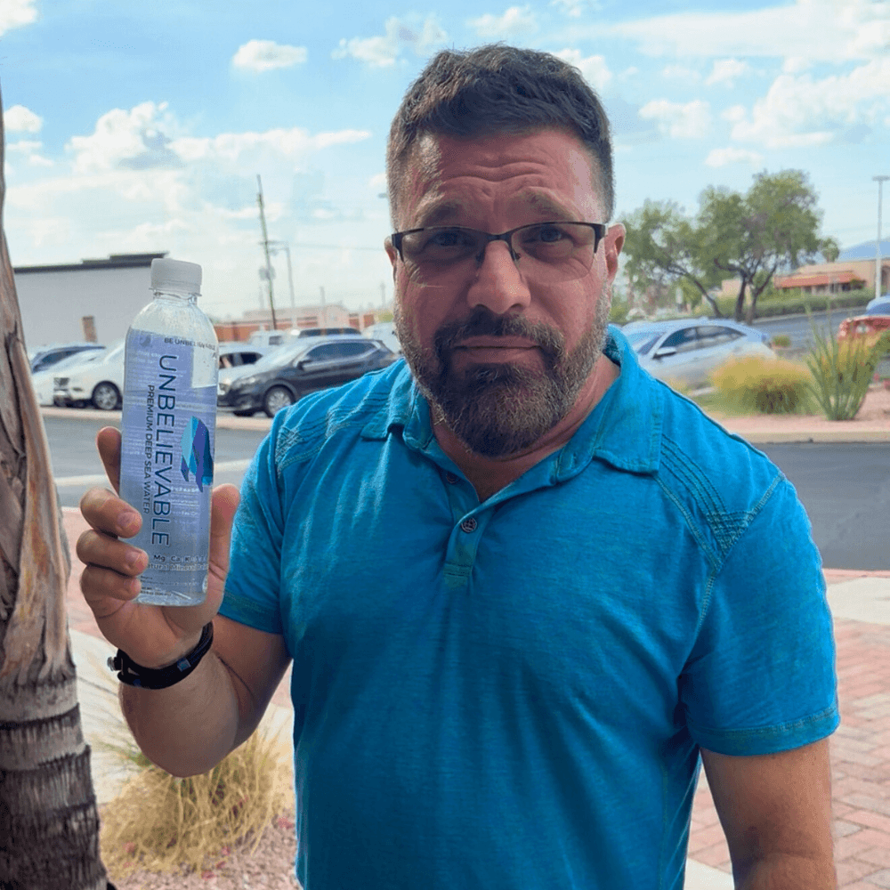 smiling woman wearing white and black pinstriped collared top