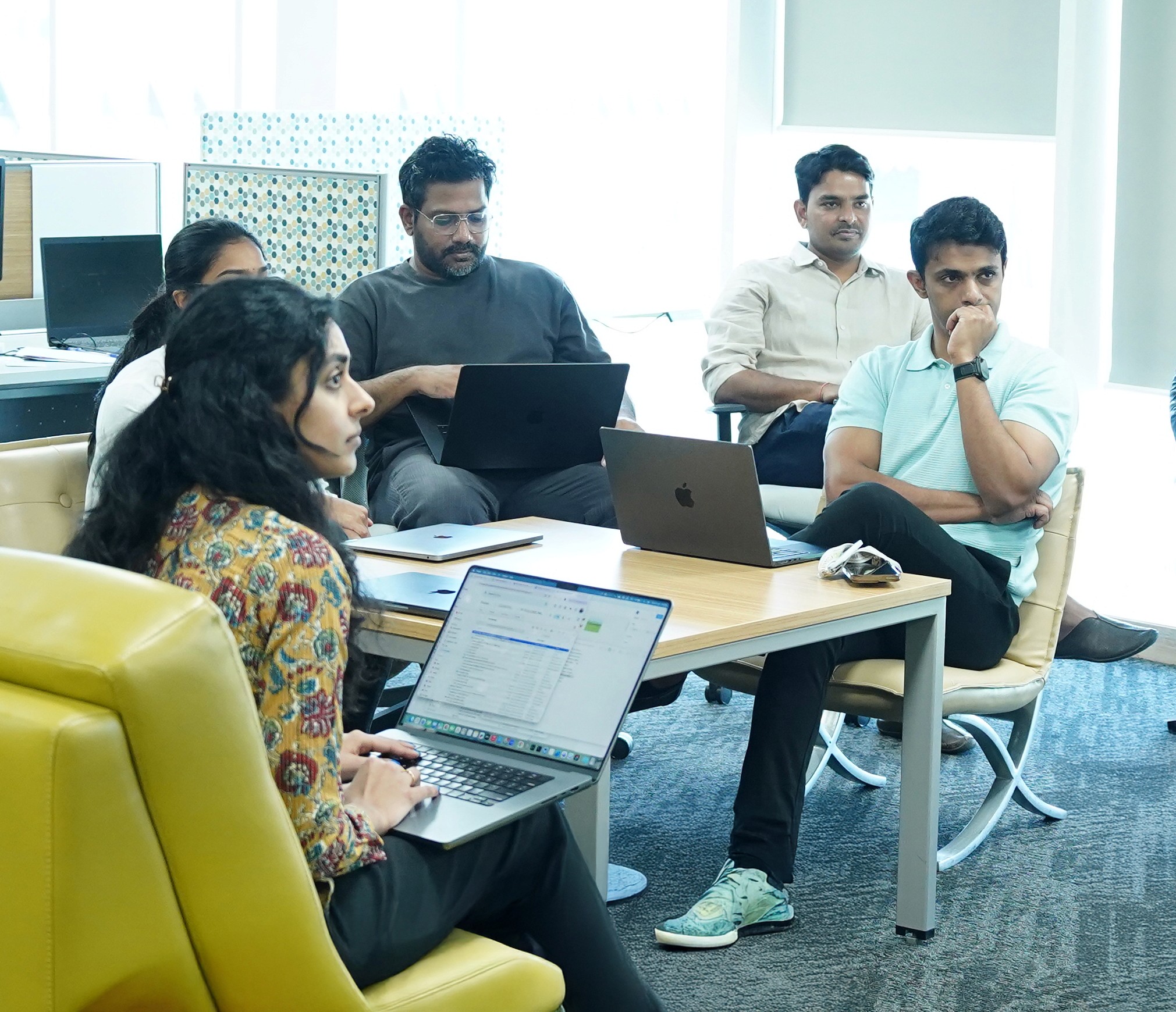 people sitting on chair in front of laptop computers