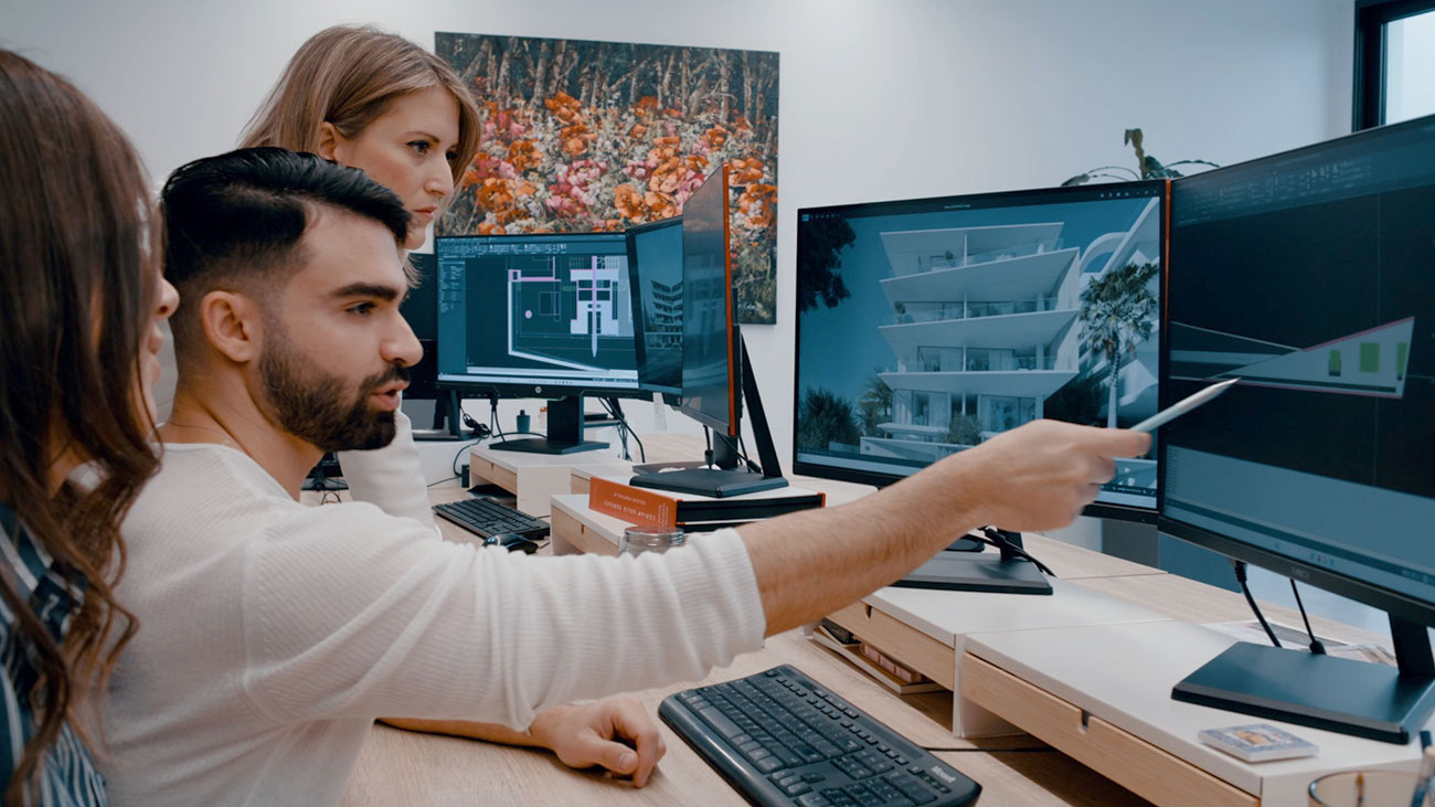 Team reviewing designs on screens, MIA Developments shoot by TERAMOK