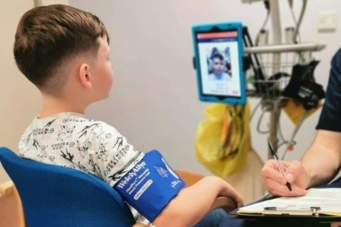 Picture of a boy using Lifelight at a doctors office