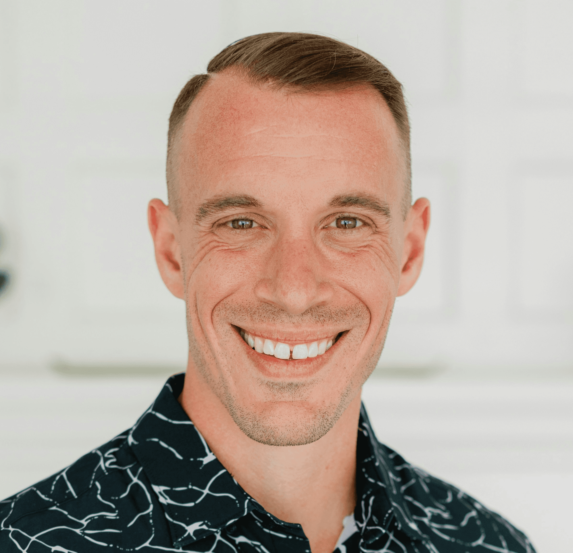 Smiling man poses for a photo.