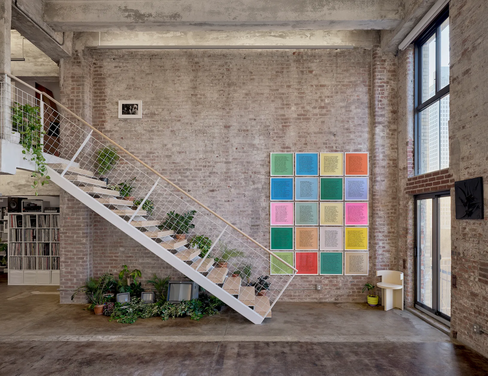 connecting stair and open public areas of residence with uplit existing concrete ceilings