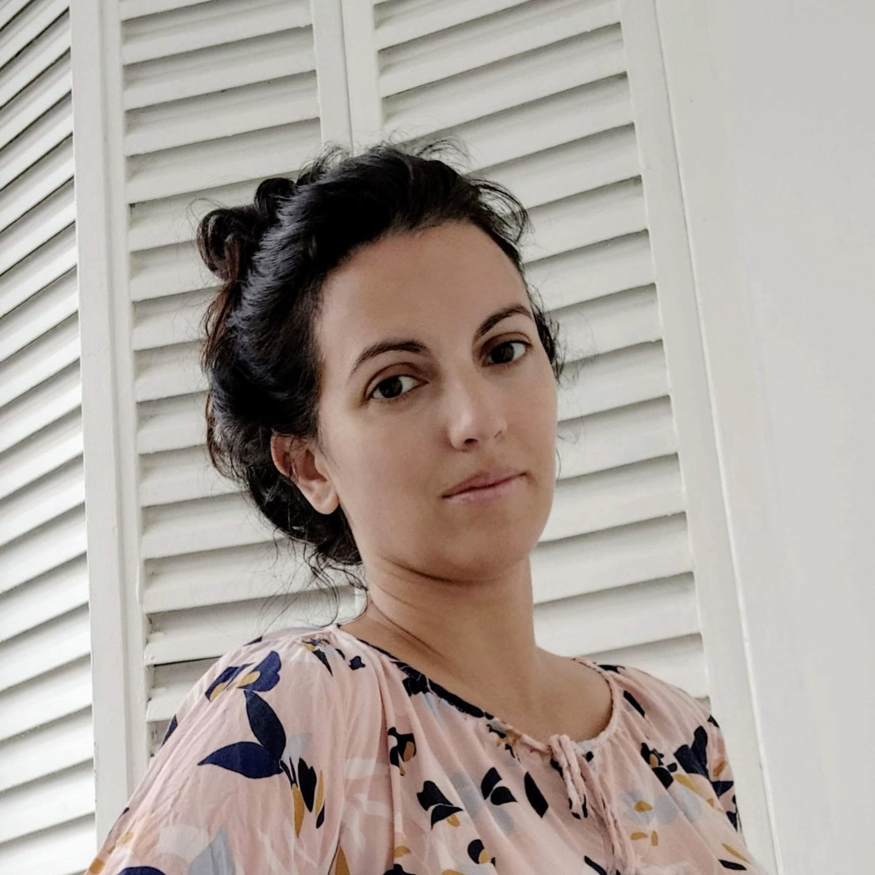 grayscale photo of woman wearing necklace and top