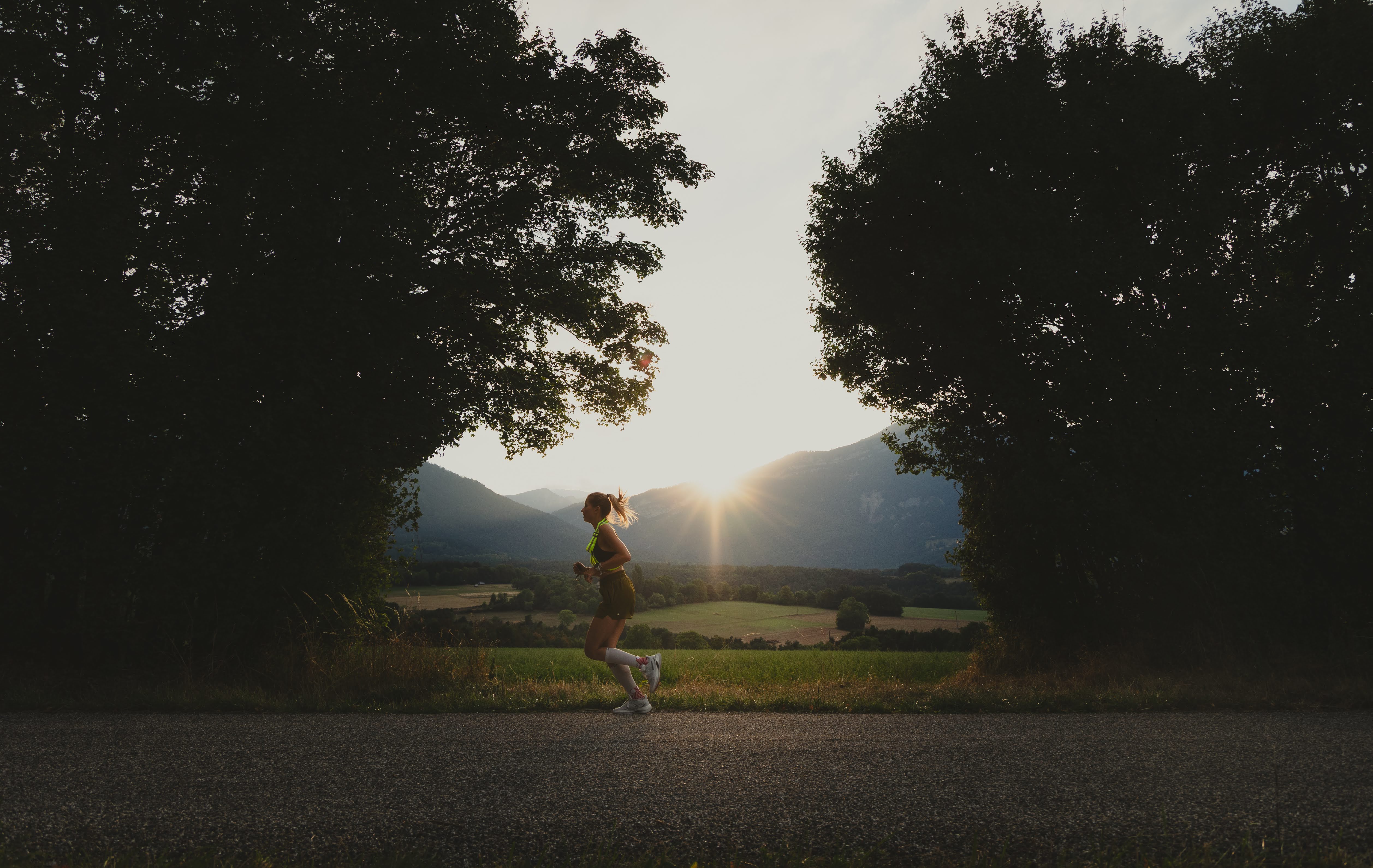 Women Trail Runner Running on the road