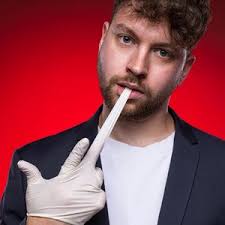 A woman sitting on top of a wooden chair