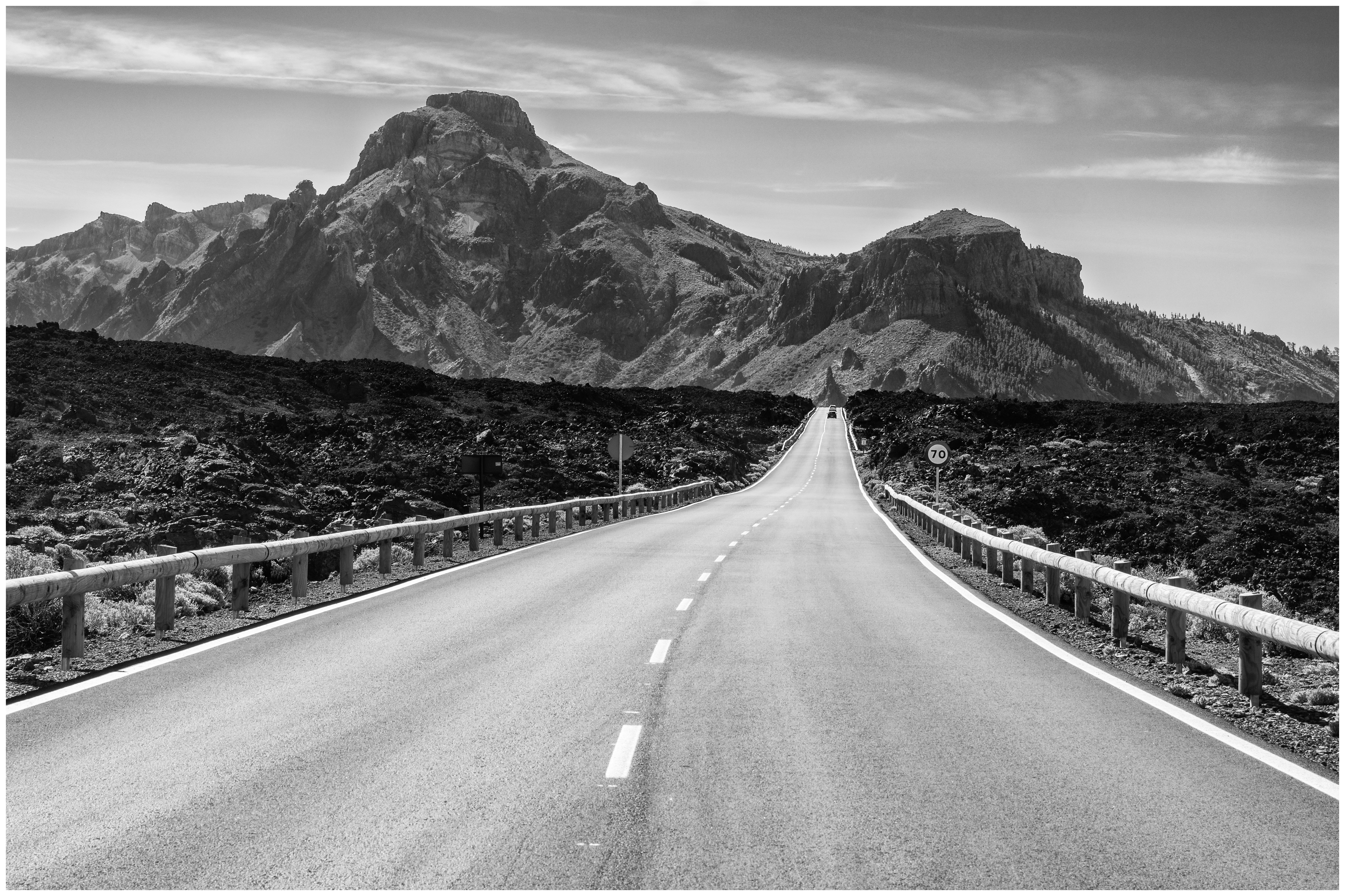 road near mountains during daytime