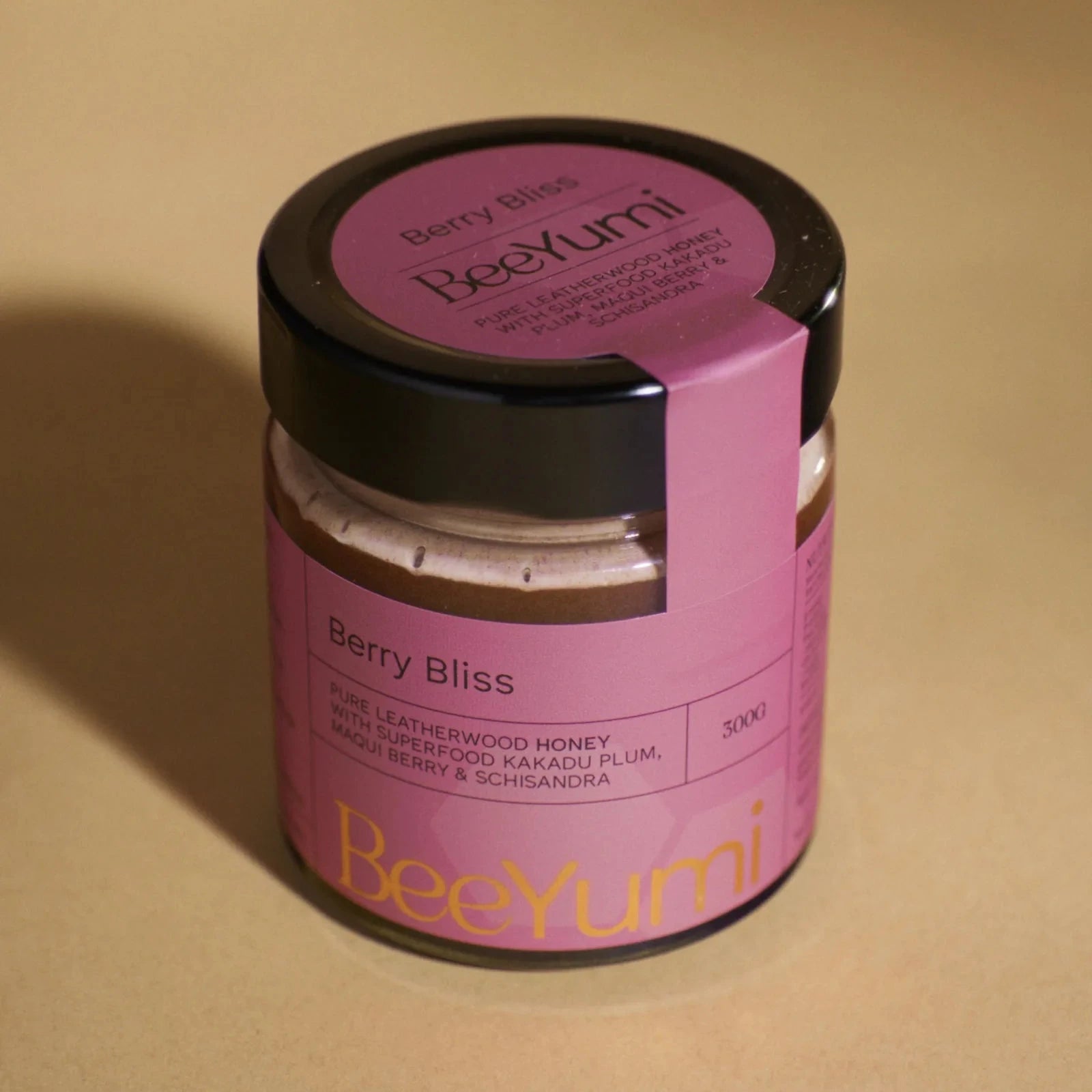 Jar of BeeYumi Berry Bliss on a beige background