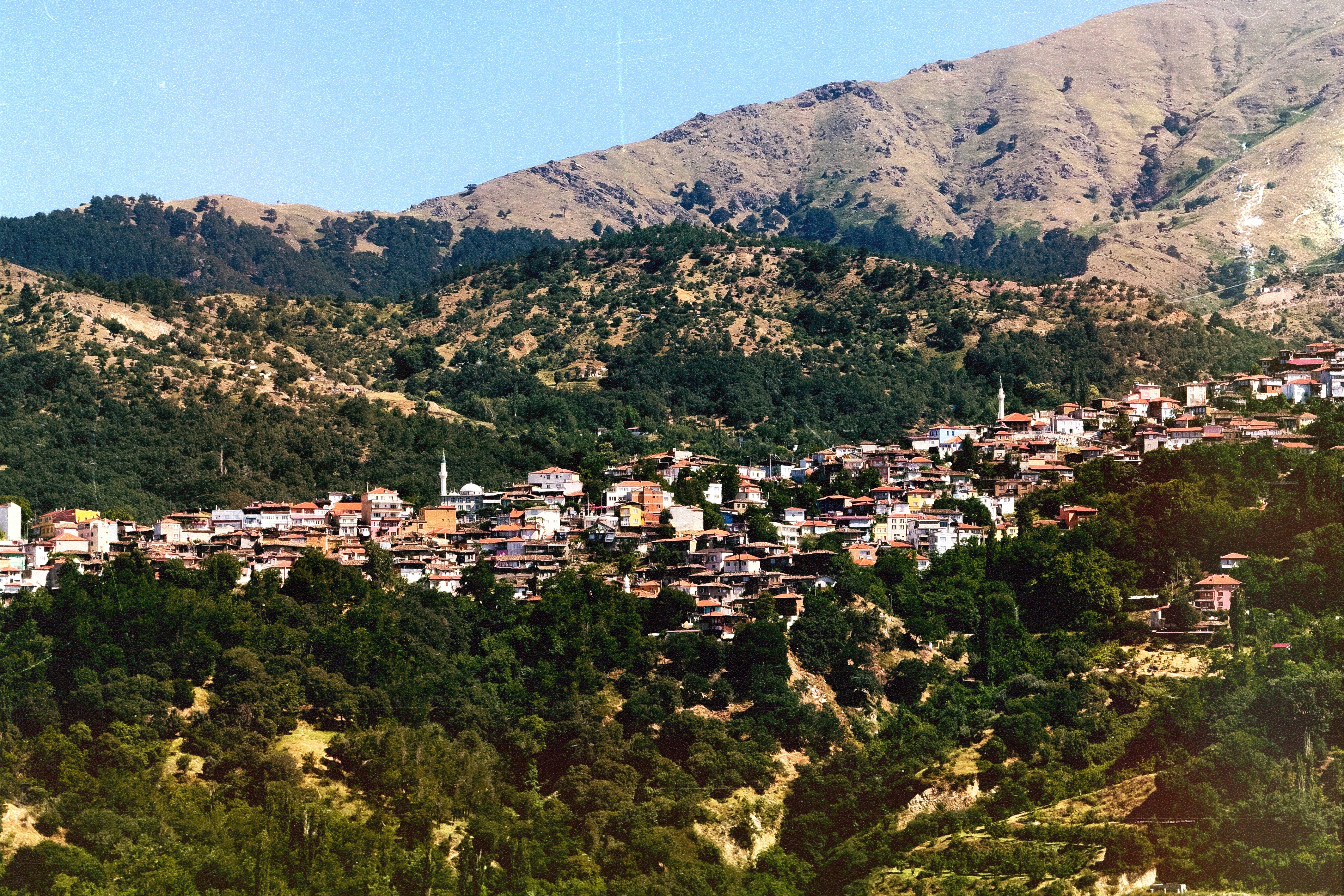 A village nestled in a mountainous landscape.