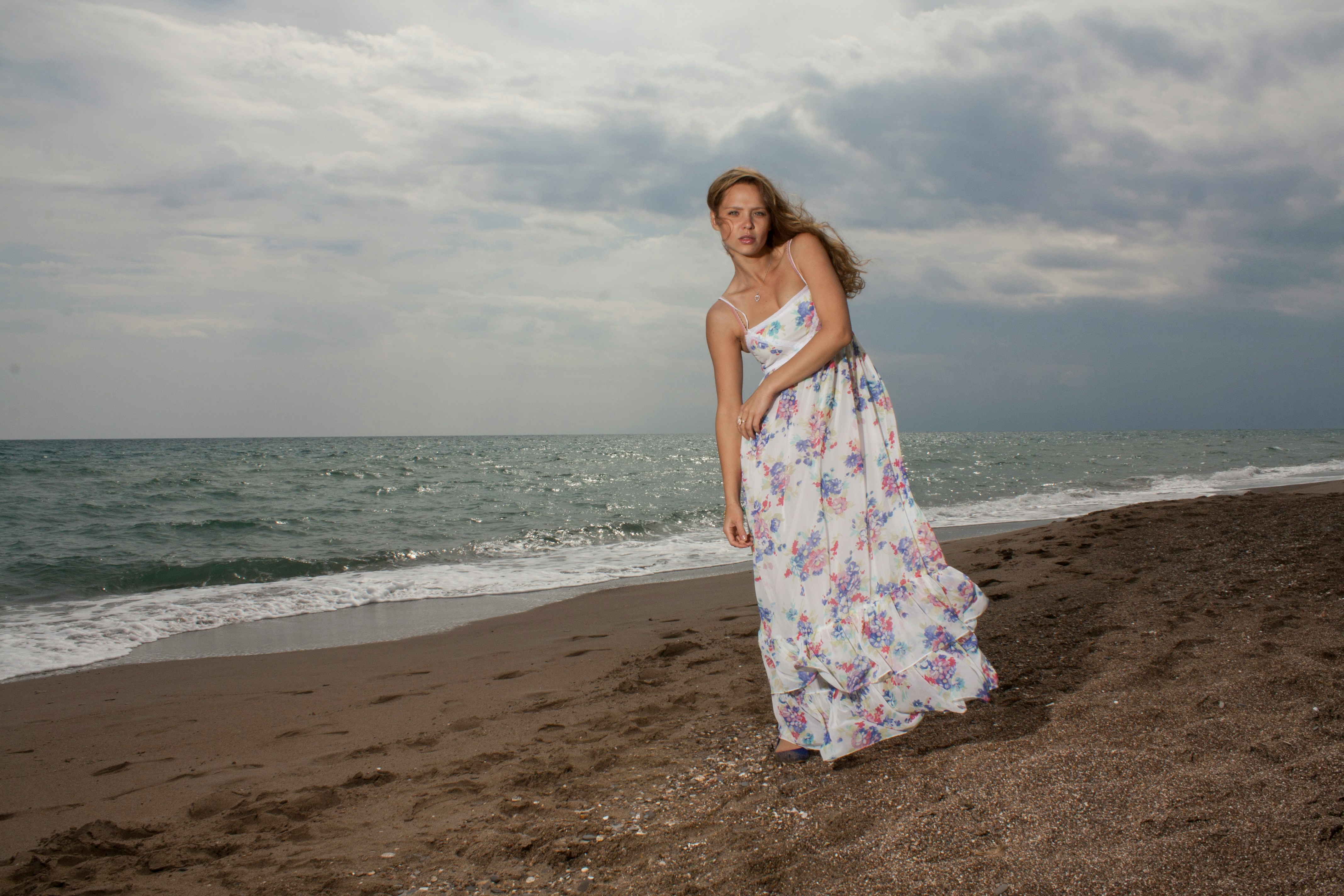 woman at a beach walking - Fall Date Outfits