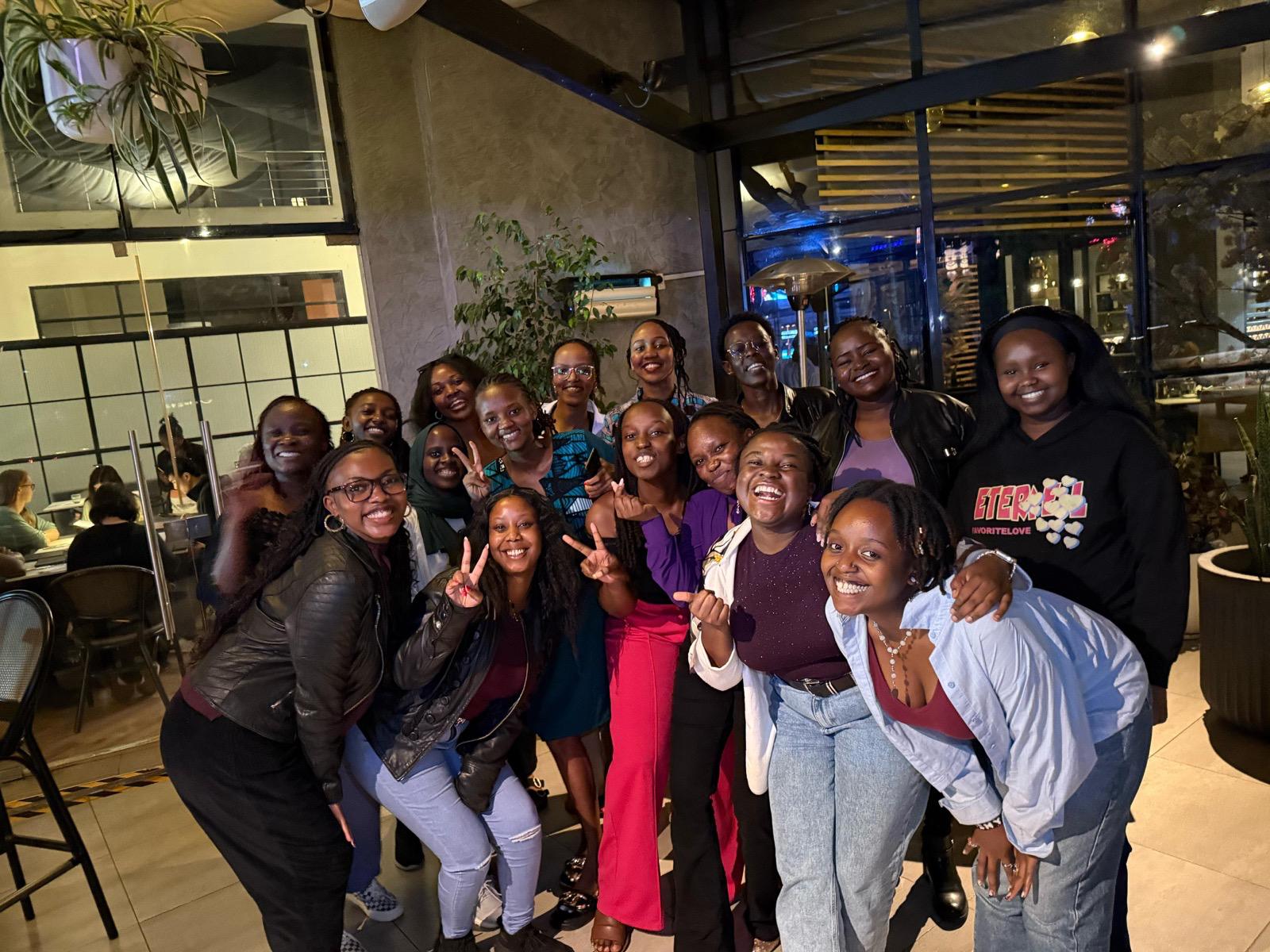 people in a large building with Tate Modern in the background