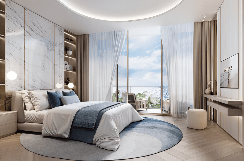 A modern bedroom featuring a large round bed, designed for comfort and style, located in The Symphony by Imtiaz.