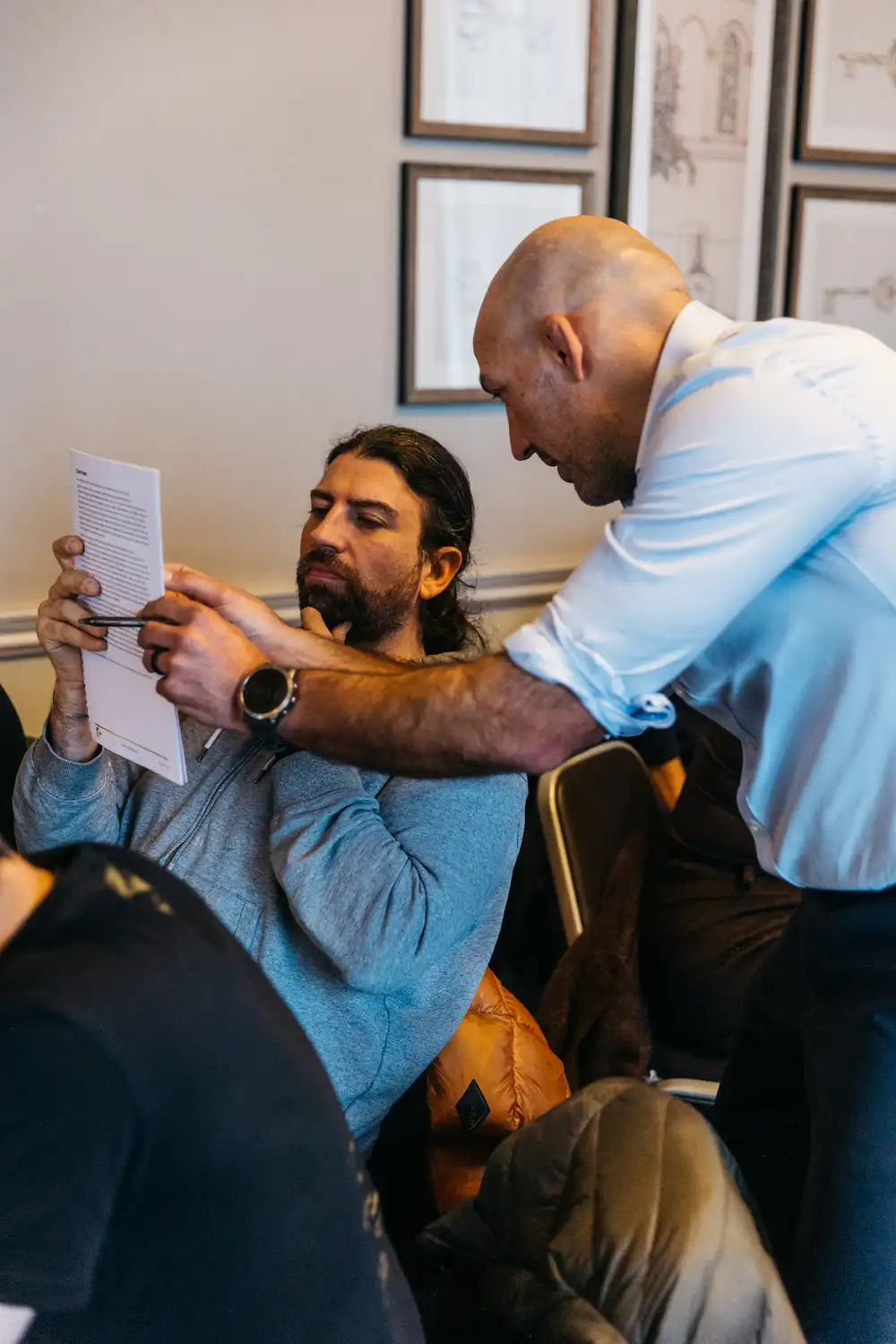 A person getting a hair cut in an office.