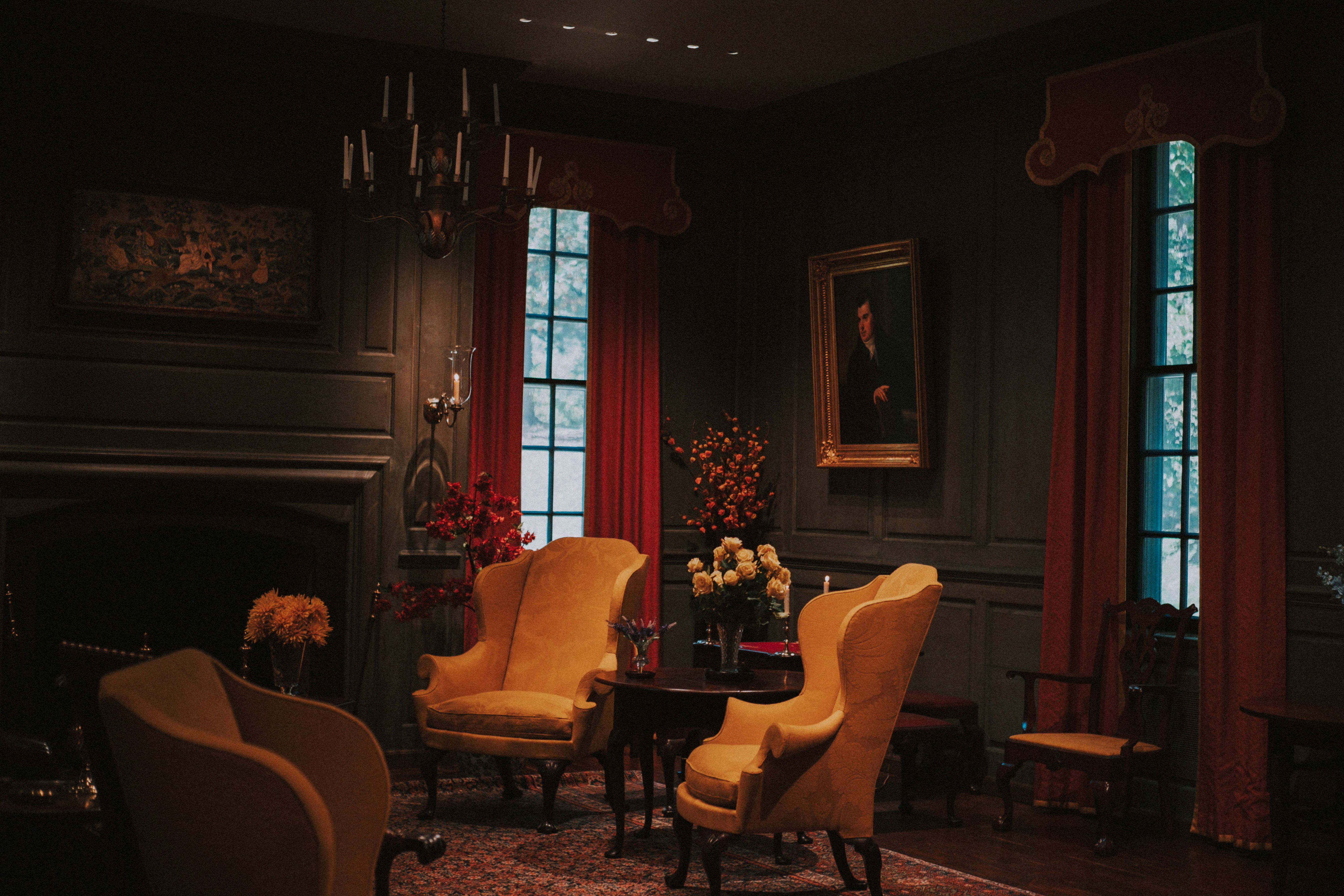 Elegant living room with yellow armchairs and fireplace.