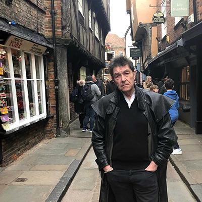 Beloved Derbyshire historian and Most Haunted TV presenter RIchard Felix, Tour historian for Hartingtons Heritage tours derbyshire walking the  streets of The Shambles in Yorkshire