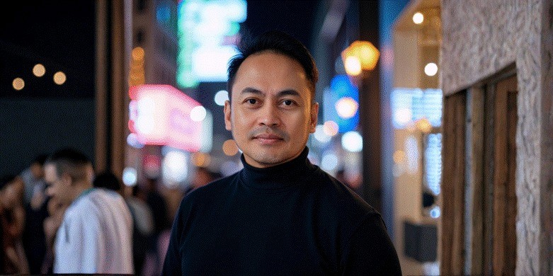 Remel Garganera, founder of TGL Innovations, standing confidently, showcasing his journey from military service to entrepreneurial success in funding solutions for small businesses.