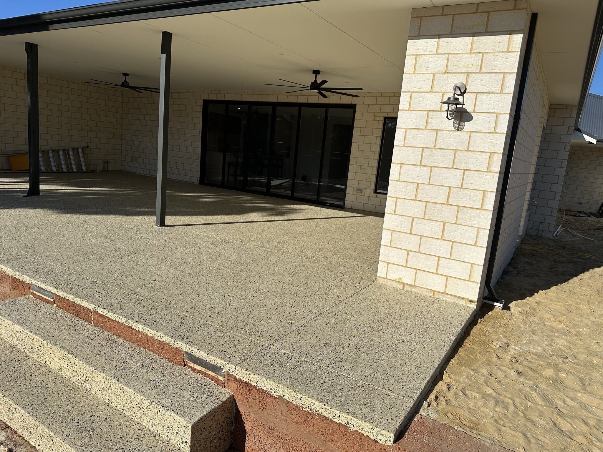 Rachel, personal trainer, looking to the side confidently in a fitness studio