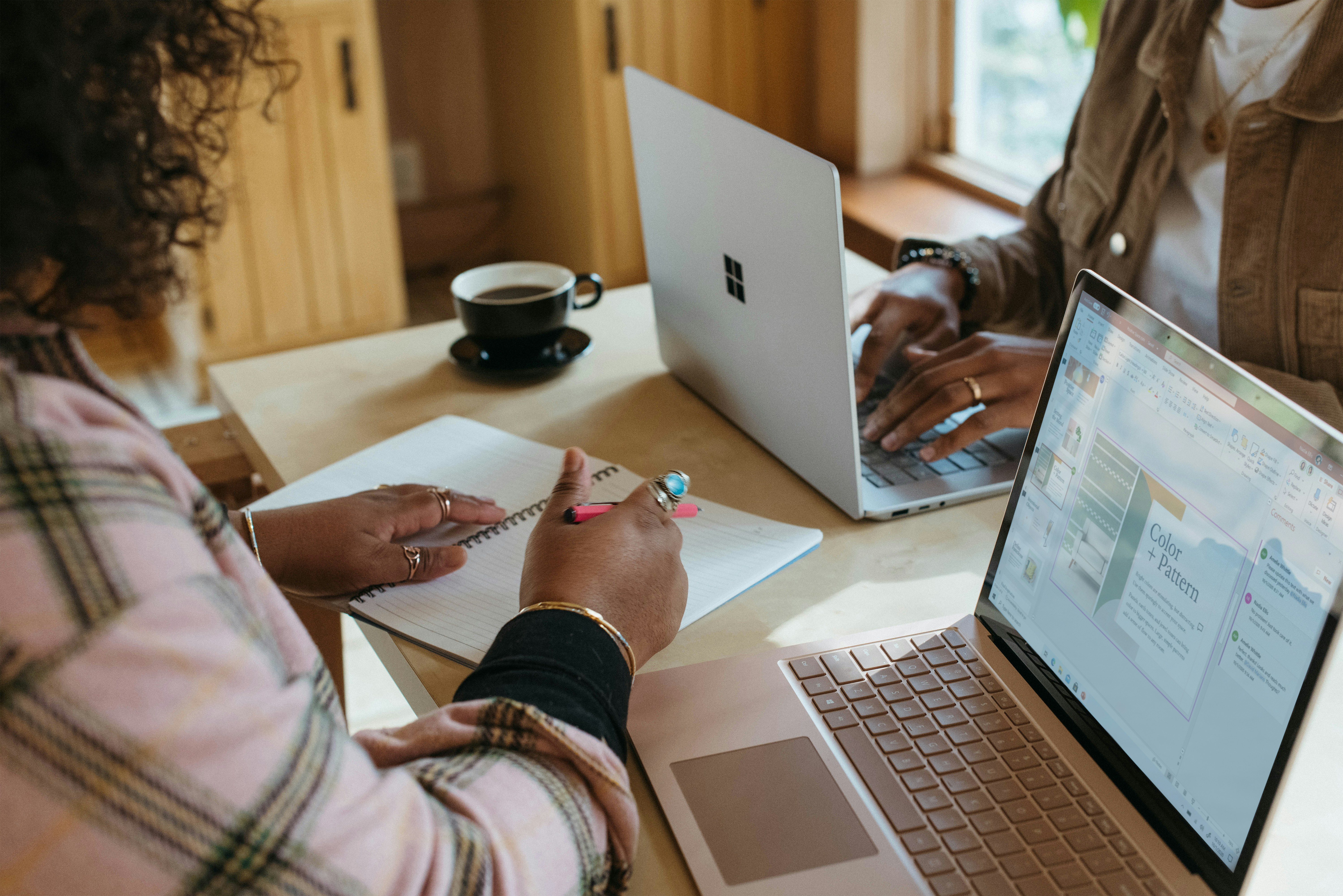 girl writing an essay format sitting in front of laptop