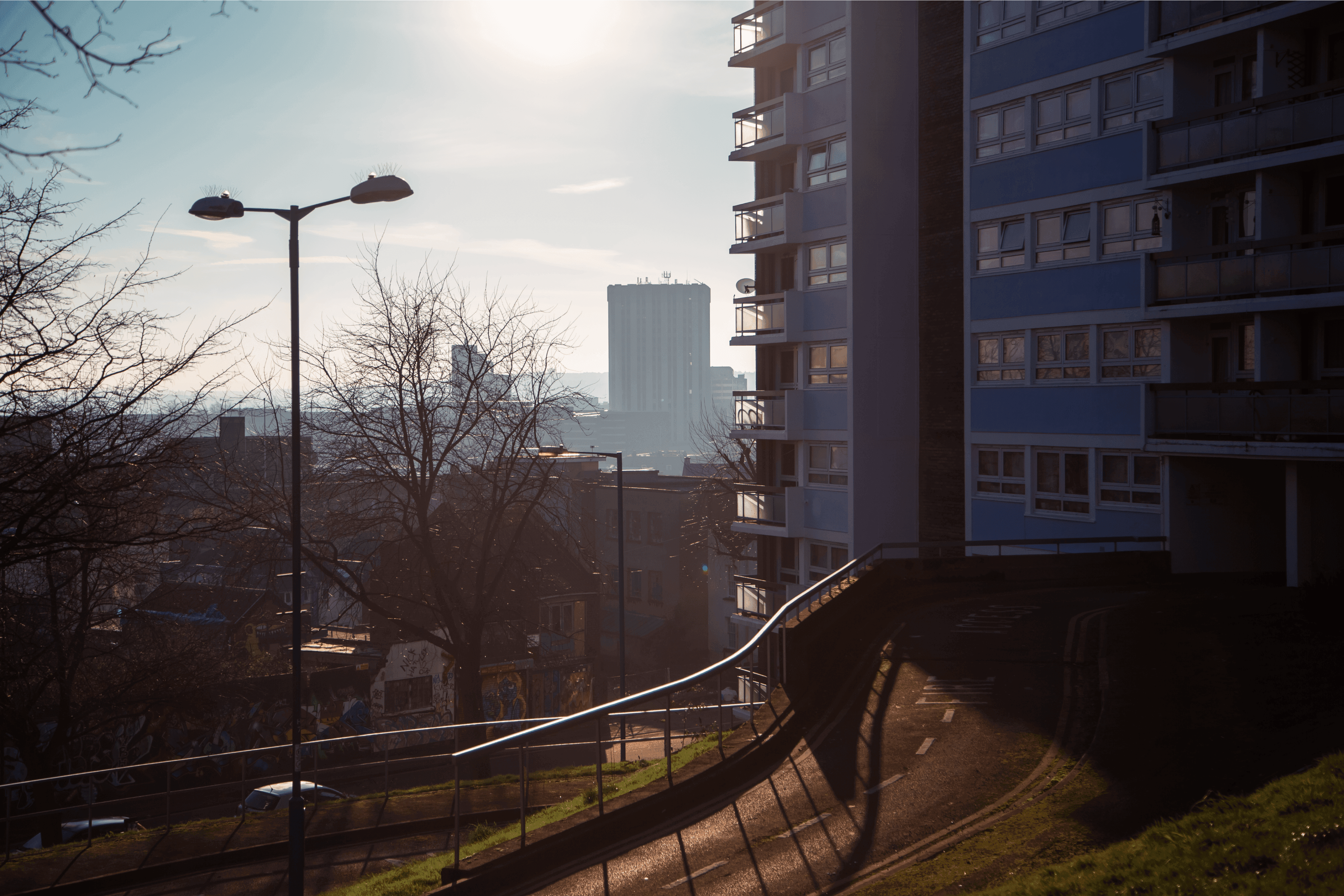 View from Nine Tree Hill in Bristol a tower block is in the foreground and the sun is shining