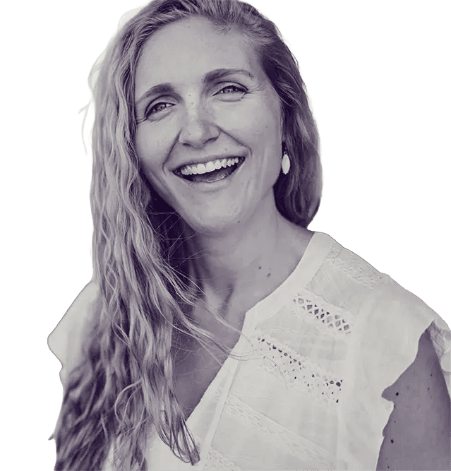 A woman with long hair smiles warmly, exuding a friendly and approachable demeanor.