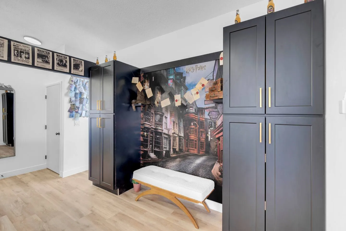 Hallway with a themed mural and tall cabinets, Wizard’s Dream in North Las Vegas