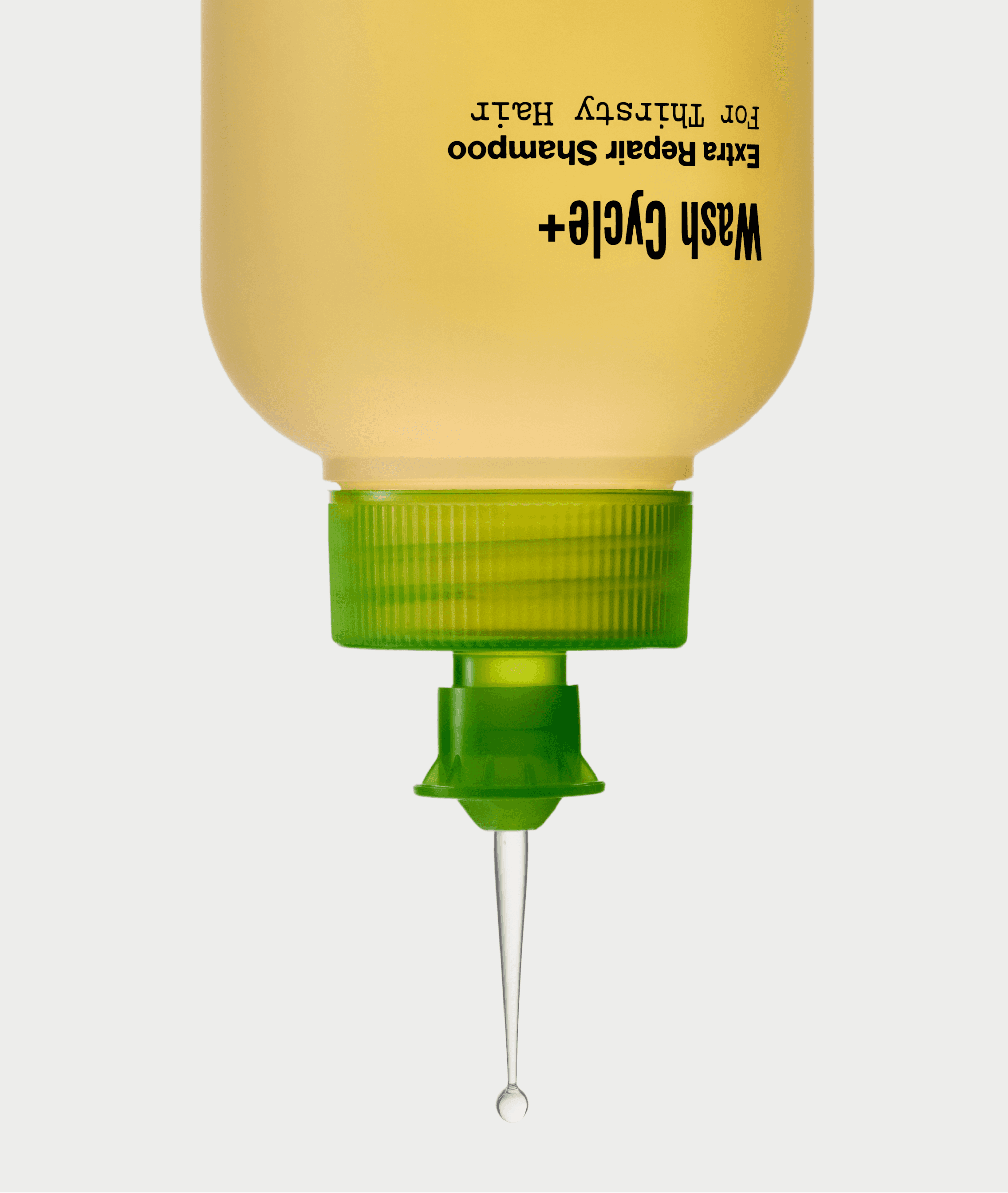 Grow-Good Beauty Wash Cycle+ Extra Repair Shampoo in upside-down dish soap squeeze bottle packaging