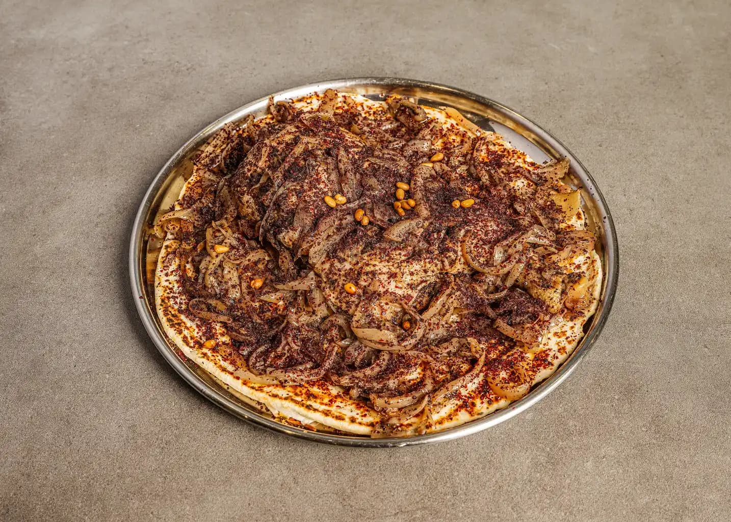  A rustic charcuterie board loaded with sliced cured meats