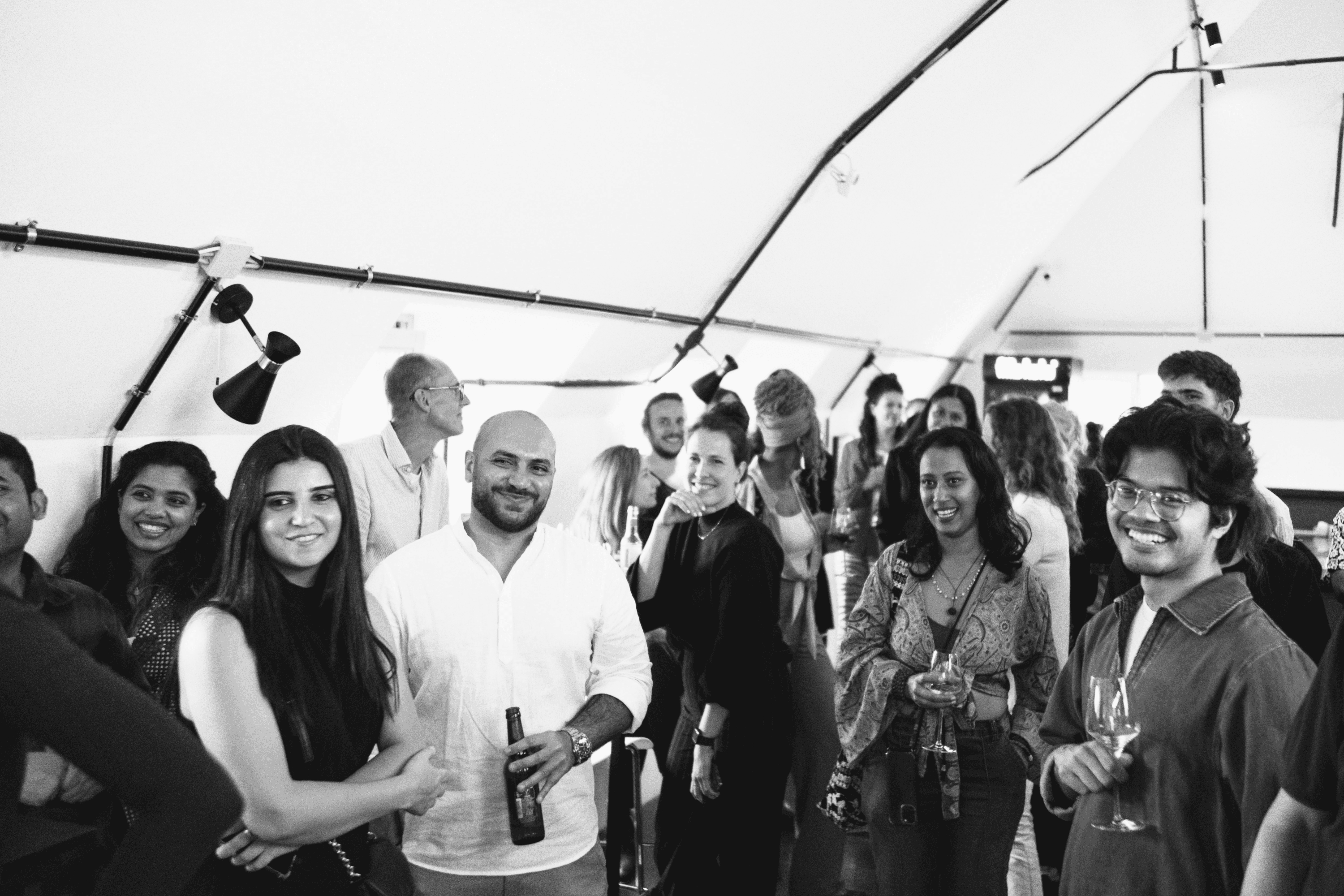 Interior of a cafe or workspace with several people at tables