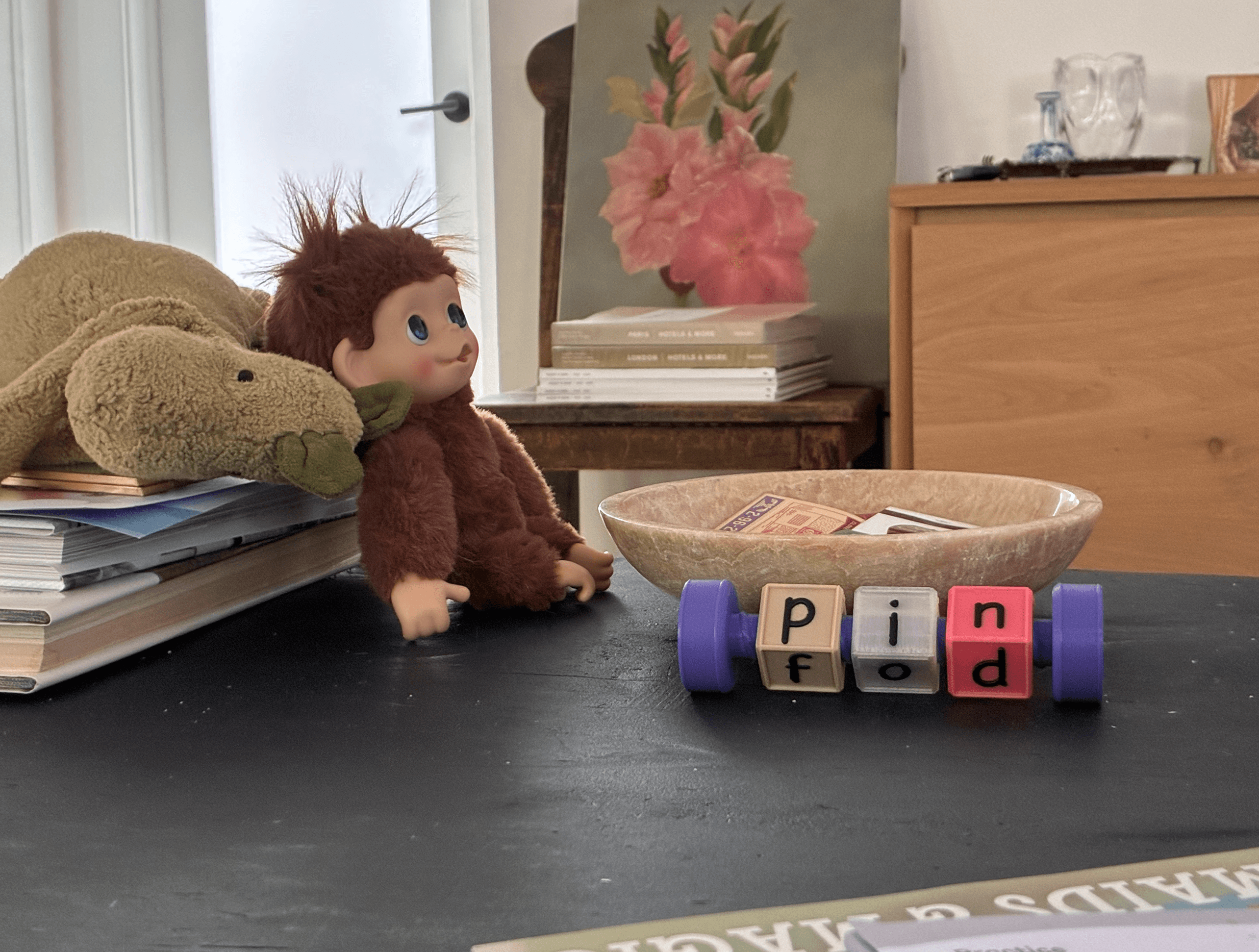 Word Nuts Reading bolt loaded with letter nuts sitting on a family coffee table, ready for a five-minute phonics session