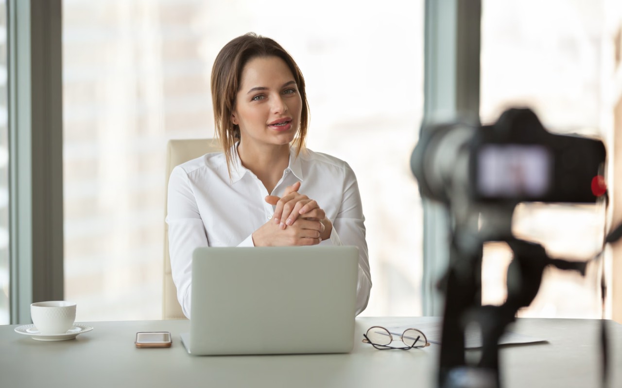 An HR professional filming a recruitment video.