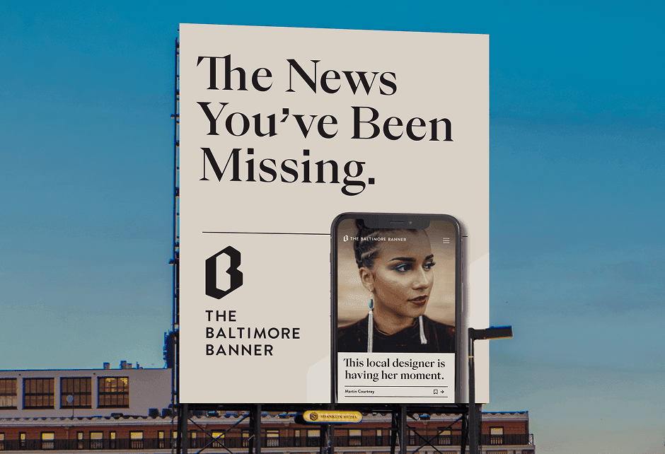 A billboard for The Baltimore Banner displays the slogan The News You’ve Been Missing with a smartphone showing a news story about a local designer.