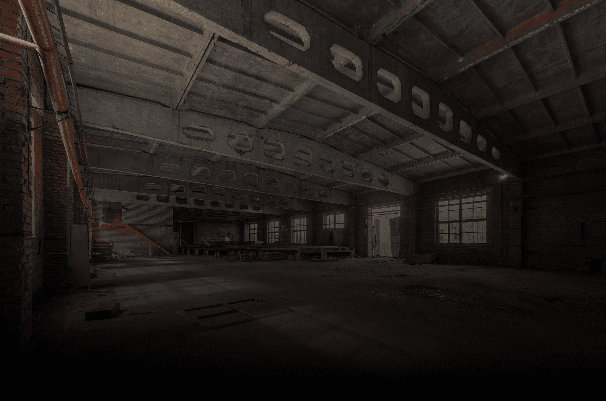 A man in a suit and sunglasses standing on a street