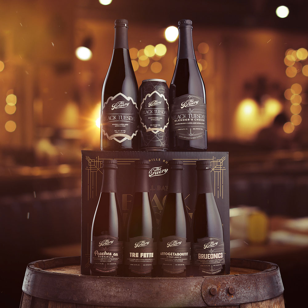 Black Tuesday bottles stacked in dramatic lighting