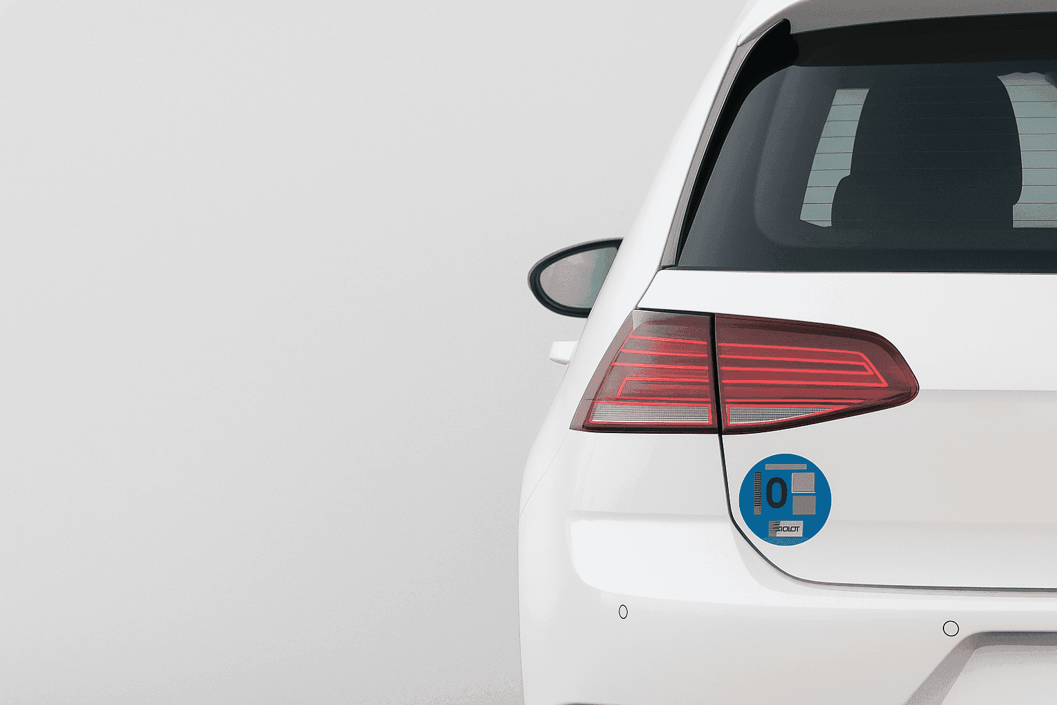 Low emission sticker on a white car. Environmental badge.