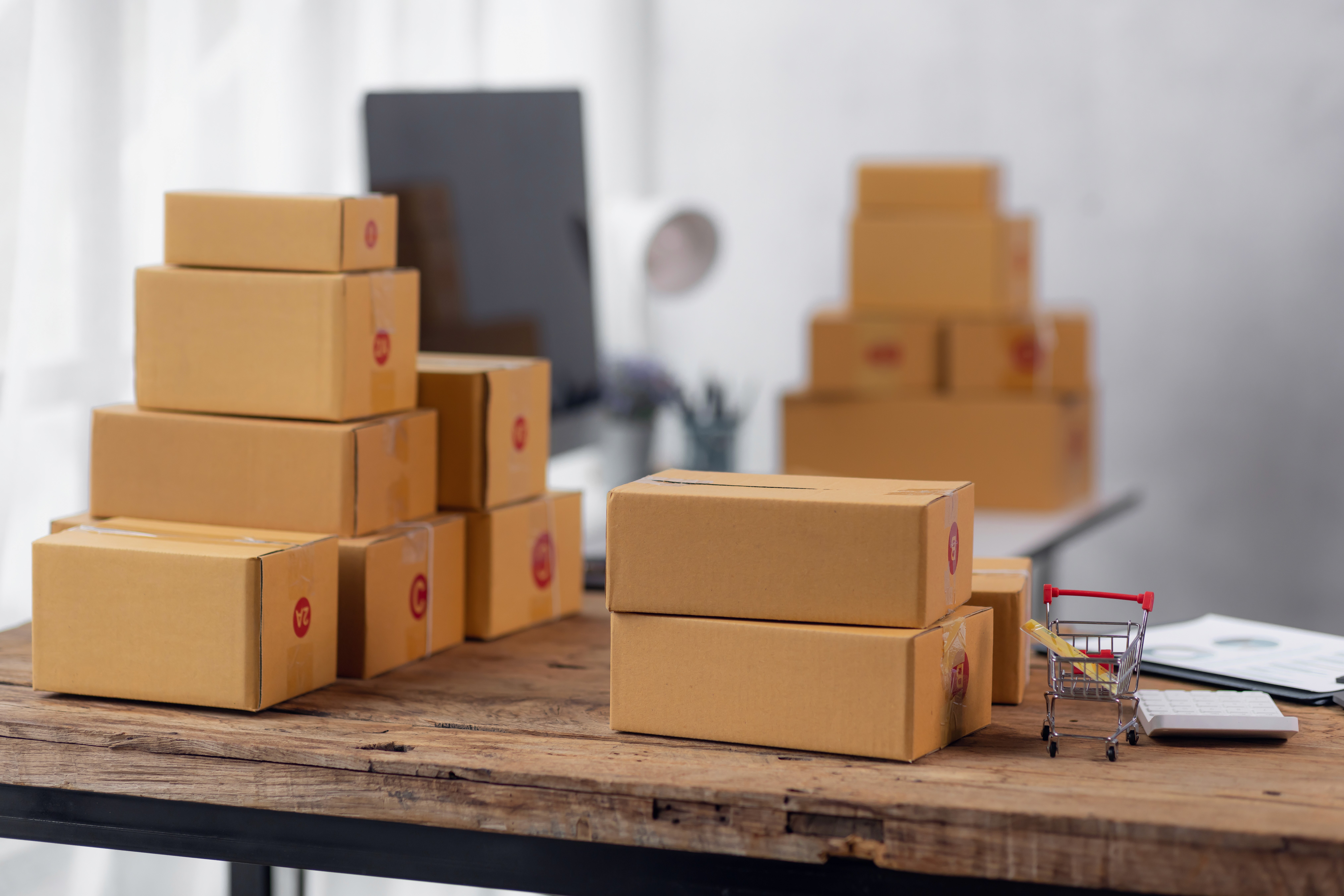 three people sitting in front of table laughing together